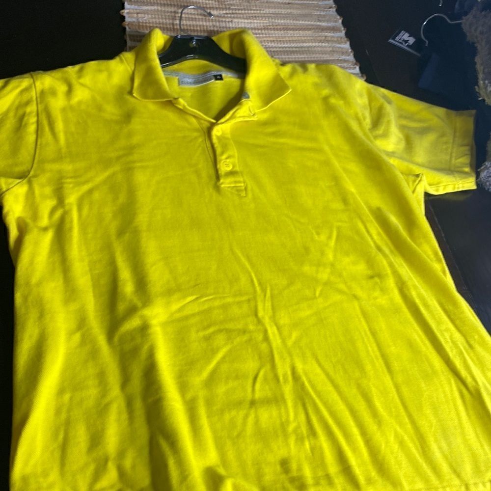 EUC bright yellow polo labeled as an XL fits more like a small / medium